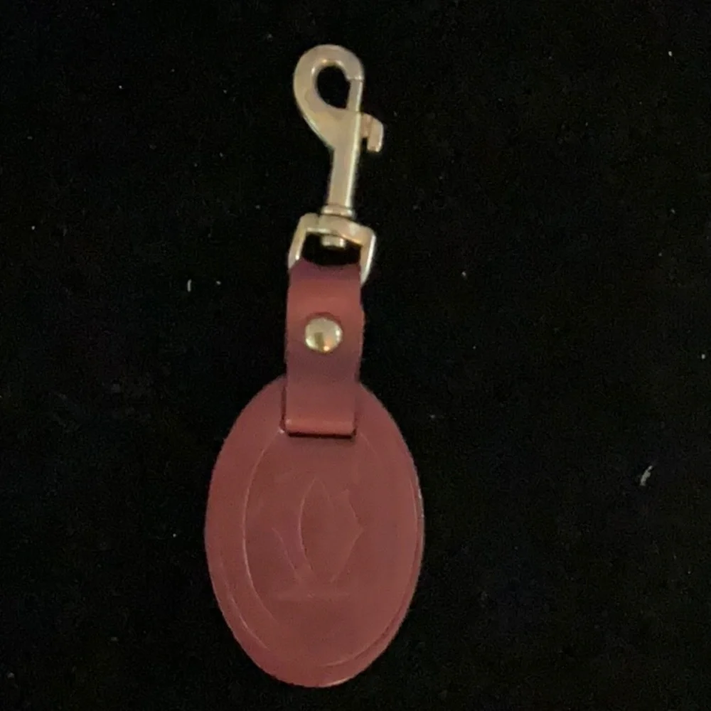 Cartier Elegant Red Leather Keychain with Gold Hardware